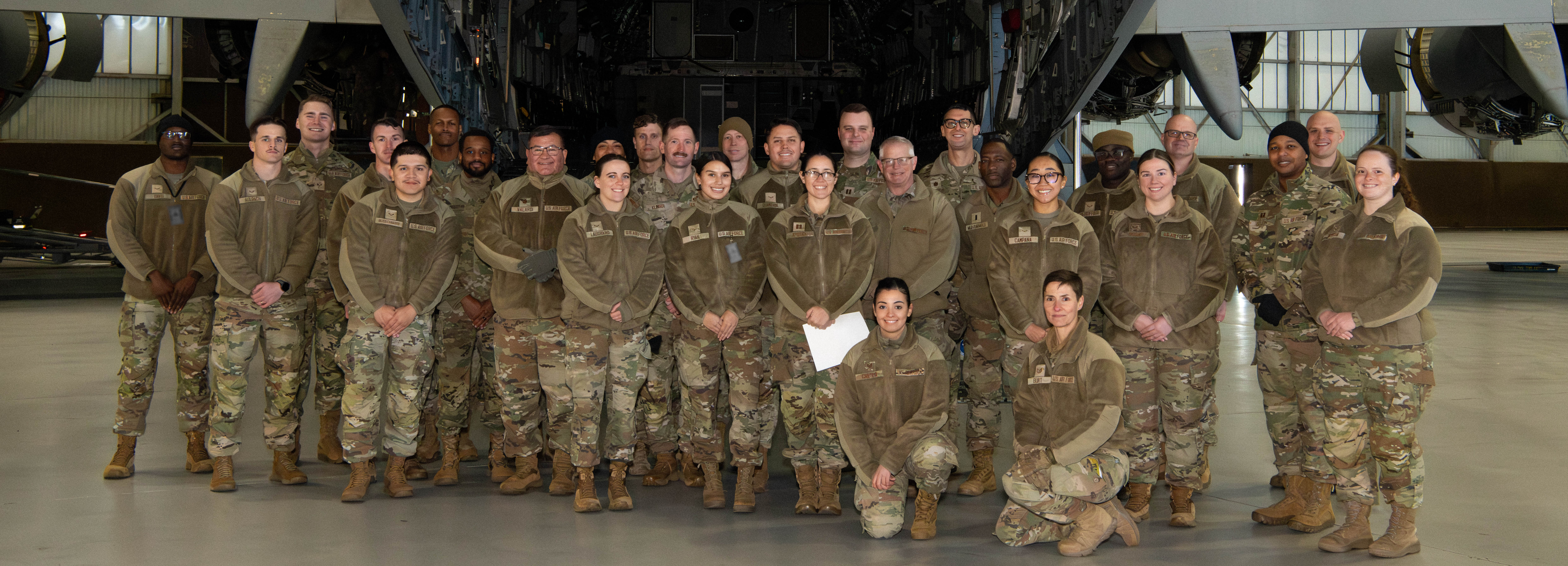 A photo of Airmen standing in front of a C-17 Globemaster III.